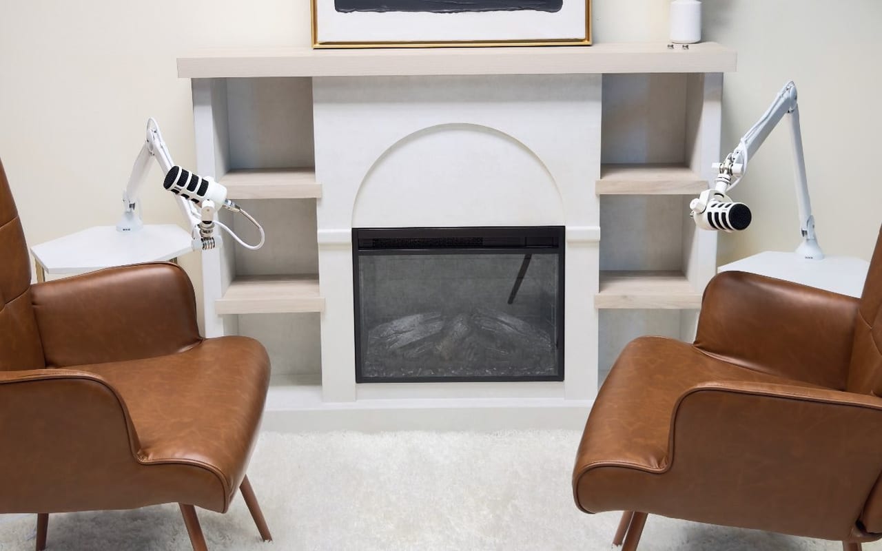 The Hearth: two brown armchairs beside a fireplace